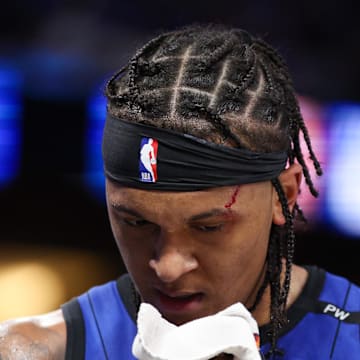 Orlando Magic forward Paolo Banchero (5) attends to a cut on his head against the Atlanta Hawks in the fourth quarter at Kia Center. 