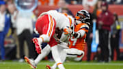 Nov 16, 2025; Denver, Colorado, USA; Denver Broncos cornerback Ja'Quan McMillian (29) sacks Kansas City Chiefs quarterback Patrick Mahomes (15) in the fourth quarter at Empower Field at Mile High. Mandatory Credit: Ron Chenoy-Imagn Images