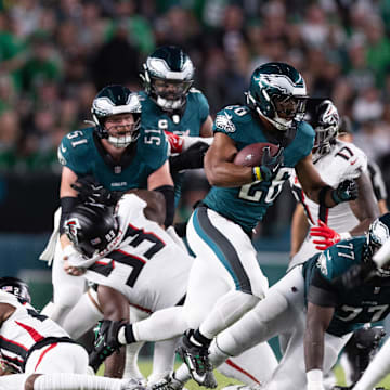 Sep 16, 2024; Philadelphia, Pennsylvania, USA; Philadelphia Eagles running back Saquon Barkley (26) runs with the ball against the Atlanta Falcons during the first quarter at Lincoln Financial Field. 