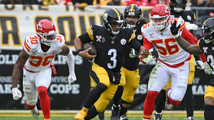 Dec 25, 2024; Pittsburgh, Pennsylvania, USA; Pittsburgh Steelers quarterback Russell Wilson (3) gains yardage while being chased by Kansas City Chiefs defenders Christian Roland-Wallace (30) and George Karlaftis (56)during the second quarter at Acrisure Stadium. Mandatory Credit: Barry Reeger-Imagn Images