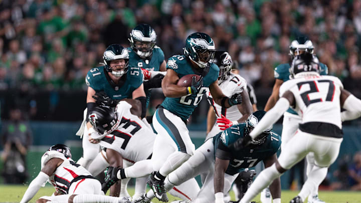 Sep 16, 2024; Philadelphia, Pennsylvania, USA; Philadelphia Eagles running back Saquon Barkley (26) runs with the ball against the Atlanta Falcons during the first quarter at Lincoln Financial Field. 