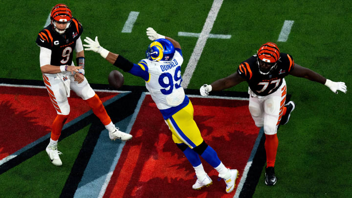 Cincinnati Bengals quarterback Joe Burrow (9) throws the ball as Los Angeles Rams defensive end Aaron Donald (99) pressers him after getting away from Cincinnati Bengals guard Hakeem Adeniji (77) in the second half during Super Bowl 56, Sunday, Feb. 13, 2022, at SoFi Stadium in Inglewood, Calif. Los Angeles Rams defeated Cincinnati Bengals 23-20.

Nfl Super Bowl 56 Los Angeles Rams Vs Cincinnati Bengals Feb 13 2022 Albert Cesare 5923