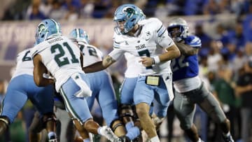 Oct 13, 2023; Memphis, Tennessee, USA; Tulane Green Wave quarterback Michael Pratt (7) hands the ball off to running back Makhi Hughes (21) during the second half against the Memphis Tigers at Simmons Bank Liberty Stadium. Mandatory Credit: 