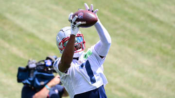 Jun 12, 2024; Foxborough, MA, USA;  New England Patriots wide receiver JuJu Smith-Schuster (7) makes a catch at minicamp at Gillette Stadium.  Mandatory Credit: Eric Canha-USA TODAY Sports