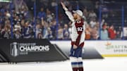 Jun 26, 2022; Tampa, Florida, USA; Colorado Avalanche left wing Gabriel Landeskog (92) waves to family in the stands during the on ice celebration after the Avalanche game against the Tampa Bay Lightning in game six of the 2022 Stanley Cup Final at Amalie Arena. Mandatory Credit: Geoff Burke-Imagn Images