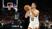 Nov 24, 2025; Phoenix, Arizona, USA; Phoenix Suns guard Collin Gillespie (12) against the Houston Rockets in the second half at Mortgage Matchup Center. Mandatory Credit: Mark J. Rebilas-Imagn Images