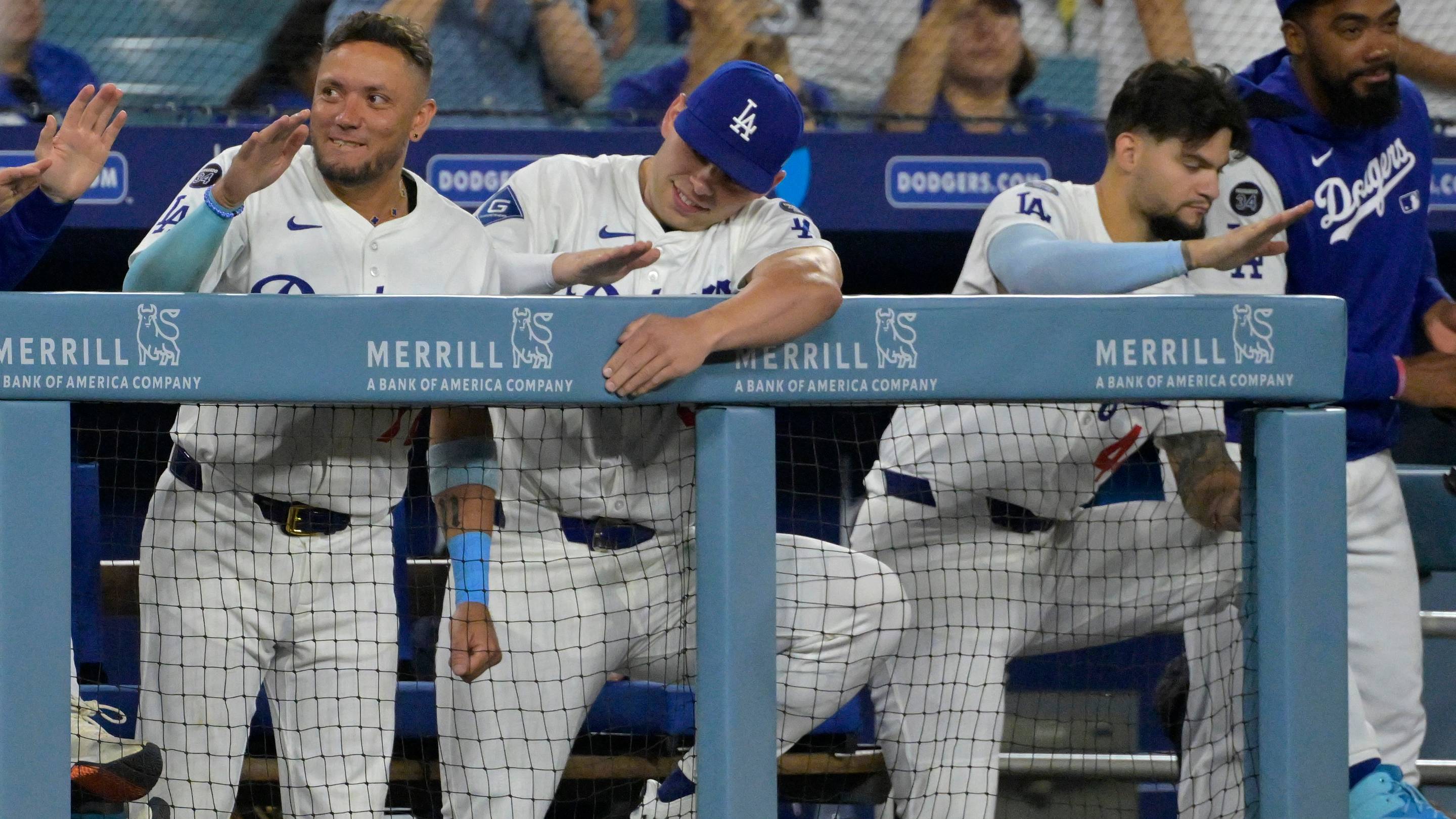 Jul 2, 2025; Los Angeles, California, USA; Los Angeles Dodgers shortstop Miguel Rojas (72), catcher Dalton Rushing (68) and center fielder Andy Pages (44) cheer from the dugout during the ninth inning against the Chicago White Sox at Dodger Stadium. Mandatory Credit: Jayne Kamin-Oncea-Imagn Images