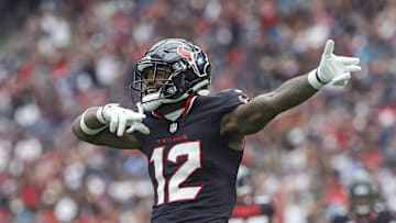 Sep 29, 2024; Houston, Texas, USA; Houston Texans wide receiver Nico Collins (12) signals after a first down during the first quarter against the Jacksonville Jaguars at NRG Stadium. Mandatory Credit: Troy Taormina-Imagn Images
