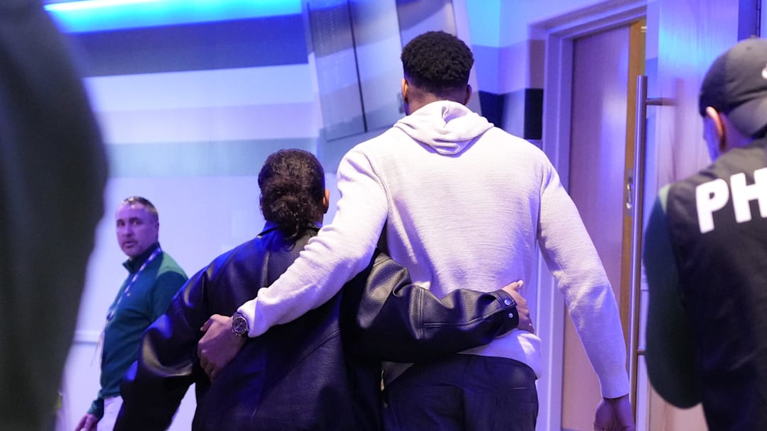 Apr 10, 2026; Milwaukee, Wisconsin, USA;  Milwaukee Bucks forward Giannis Antetokounmpo (34) hugs his wife while walking to the locker room following the game against the Brooklyn Nets at Fiserv Forum. Mandatory Credit: Jeff Hanisch-Imagn Images