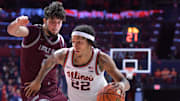 Nov 25, 2024; Champaign, Illinois, USA;  Illinois Fighting Illini guard Tre White (22) drives the ball past Little Rock Trojans forward Ante Beljan (21) during the first half at State Farm Center. Mandatory Credit: Ron Johnson-Imagn Images