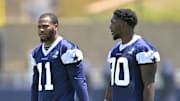 Jul 26, 2023; Oxnard, CA, USA; Dallas Cowboys linebacker Micah Parsons (11) and Dallas Cowboys defensive end DeMarcus Lawrence (90) walk on the field during training camp drill at River Ridge Playing Fields in Oxnard, CA. Mandatory Credit: Jayne Kamin-Oncea-Imagn Images