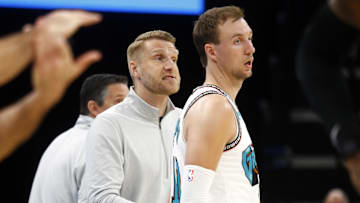 Mar 29, 2025; Memphis, Tennessee, USA; Memphis Grizzlies interim head coach Tuomas Iisalo talks with guard Luke Kennard (10) during the third quarter against the Los Angeles Lakers at FedExForum. Mandatory Credit: Petre Thomas-Imagn Images