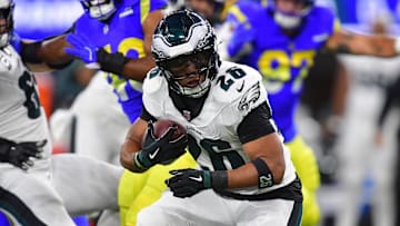 Nov 24, 2024; Inglewood, California, USA; Philadelphia Eagles running back Saquon Barkley (26) runs the ball against the Los Angeles Rams during the first half at SoFi Stadium. Mandatory Credit: Gary A. Vasquez-Imagn Images