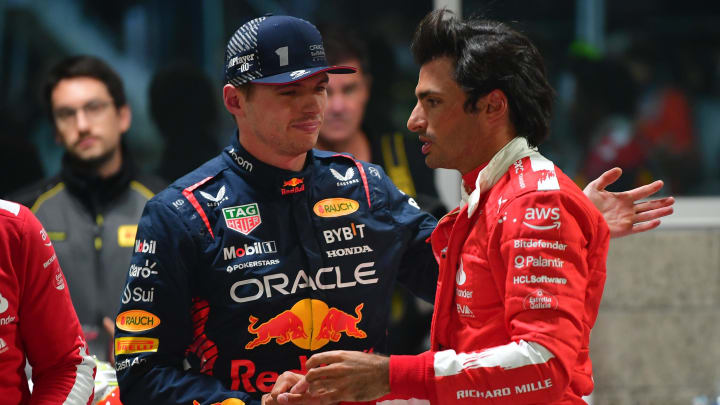 Nov 17, 2023; Las Vegas, Nevada, USA; Red Bull Racing driver Max Verstappen of The Netherlands (1) greets Scuderia Ferrari driver Carlos Sainz Jr. of Spain (55) following qualifying at Las Vegas Strip Circuit. Mandatory Credit: Gary A. Vasquez-USA TODAY Sports