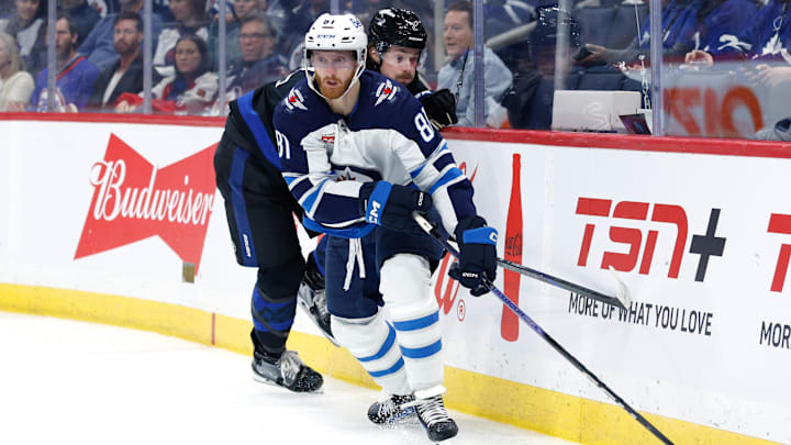 Oct 28, 2024; Winnipeg, Manitoba, CAN; Winnipeg Jets forward Kyle Connor (81) skates away from Toronto Maple Leafs defensemen Simon Benoit (2) during the second period at Canada Life Centre. Mandatory Credit: Terrence Lee-Imagn Images Oct 28, 2024; Winnipeg, Manitoba, CAN; Winnipeg Jets forward Kyle Connor (81) skates away from Toronto Maple Leafs defensemen Simon Benoit (2) during the second period at Canada Life Centre. Mandatory Credit: Terrence Lee-Imagn Images