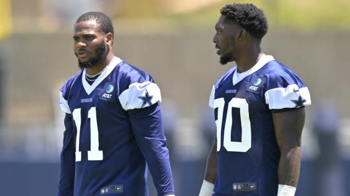 Jul 26, 2023; Oxnard, CA, USA; Dallas Cowboys linebacker Micah Parsons (11) and Dallas Cowboys defensive end DeMarcus Lawrence (90) walk on the field during training camp drill at River Ridge Playing Fields in Oxnard, CA. 