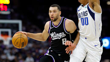 Apr 16, 2025; Sacramento, California, USA; Sacramento Kings guard Zach LaVine (8) dribbles the ball against Dallas Mavericks guard Max Christie (00) during the fourth quarter at Golden 1 Center. Mandatory Credit: Sergio Estrada-Imagn Images