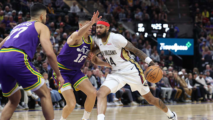 Nov 27, 2023; Salt Lake City, Utah, USA; New Orleans Pelicans forward Brandon Ingram (14) drives against Utah Jazz forward Simone Fontecchio (16) during the second half at Delta Center. Mandatory Credit: Rob Gray-Imagn Images