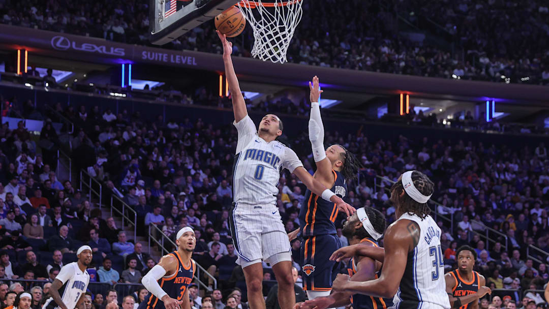 Jan 6, 2025; New York, New York, USA;  Orlando Magic guard Anthony Black (0) drives past New York Knicks guard Jalen Brunson (11) for a layup in the fourth quarter at Madison Square Garden. Mandatory Credit: Wendell Cruz-Imagn Images
