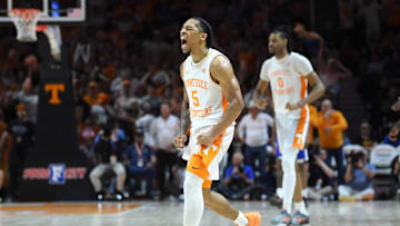 Tennessee guard Zakai Zeigler (5) forces a turnover in the final 30 seconds of an NCAA college game.