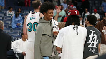 Apr 13, 2025; Memphis, Tennessee, USA; Memphis Grizzlies forward Jaylen Wells (0) reacts with guard Ja Morant (12) after defeating the Dallas Mavericks at FedExForum. Mandatory Credit: Petre Thomas-Imagn Images