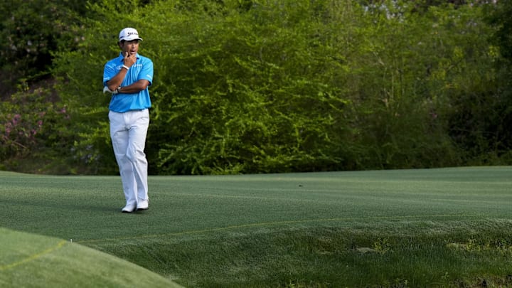 Hideki Matsuyama looks for his ball near Rae’s Creek on no. 13 during the first round of the Masters Tournament. Hideki Matsuyama looks for his ball near Rae’s Creek on no. 13 during the first round of the Masters Tournament.