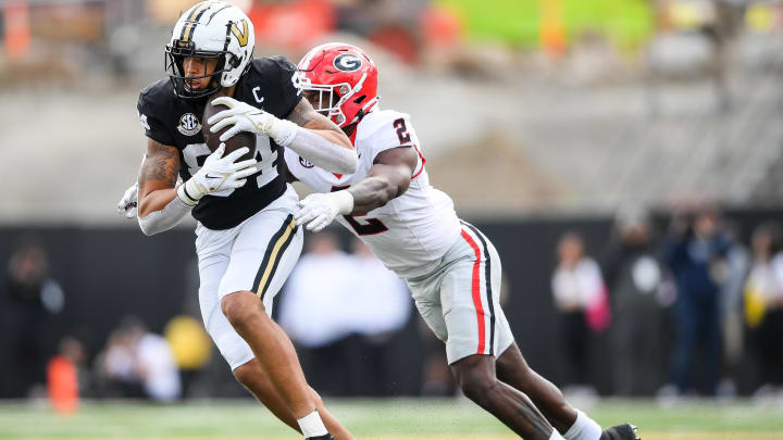 Oct 14, 2023; Nashville, Tennessee, USA;  Georgia Bulldogs linebacker Smael Mondon Jr. (2) tackles Vanderbilt Commodores tight end Justin Ball (84). during the second half at FirstBank Stadium. 
