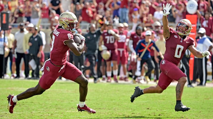 Oct 14, 2023; Tallahassee, Florida, USA; Florida State Seminoles wide receiver Hykeem Williams (8) scores a touchdown as wide receiver Ja'Khi Douglas (0) celebrates during the second half against the Syracuse Orange at Doak S. Campbell Stadium. Mandatory Credit: Melina Myers-Imagn Images