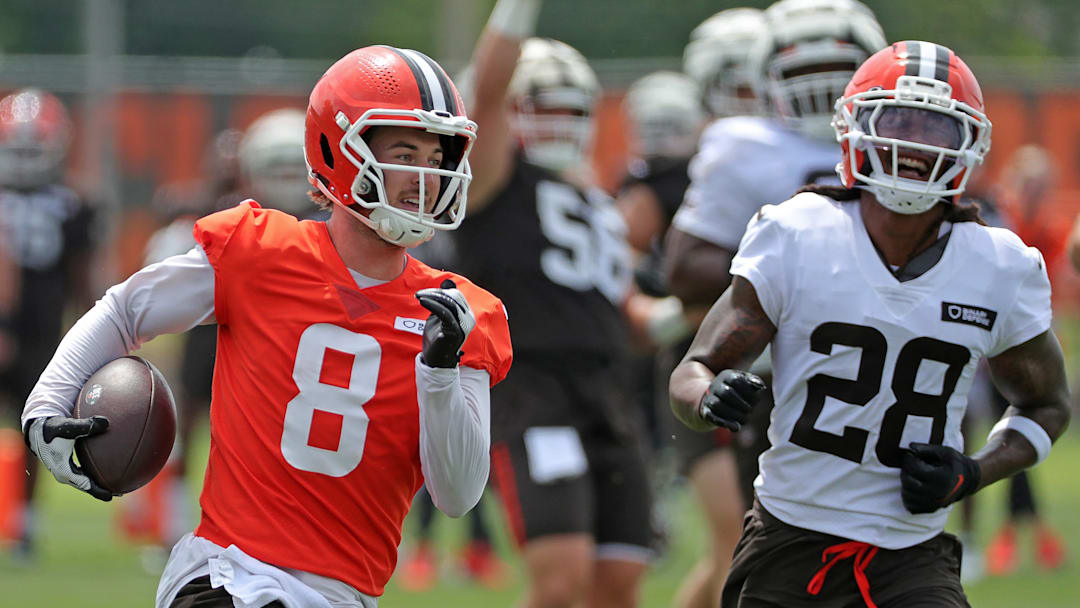 Cleveland Browns quarterback Kenny Pickett (8) runs for a touchdown as safety Rayshawn Jenkins (28) gives chase during training camp July 25, 2025, in Berea, Ohio.