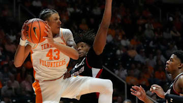 Tennessee's Cameron Carr (43) gets the rebound over Austin Peay's Me'Kell Burries (11) during an NCAA college basketball game on Sunday, Nov. 17, 2024, in Knoxville, Tenn.