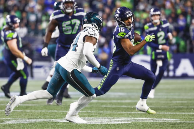 Seattle Seahawks wide receiver Tyler Lockett (16) runs for yards after the catch.