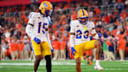 Oct 18, 2025; Syracuse, New York, USA; Pittsburgh Panthers defensive back Kavir Bains (23) celebrates his interception with teammate defensive back Rashad Battle (15) against the Syracuse Orange during the second half at the JMA Wireless Dome. Mandatory Credit: Rich Barnes-Imagn Images