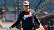 May 20, 2025; San Francisco, California, USA; San Francisco Giants first base coach Mark Hallberg (91) warms up on the field before the game between the San Francisco Giants and the Kansas City Royals at Oracle Park. Mandatory Credit: Robert Edwards-Imagn Images