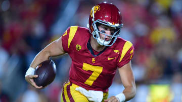 Aug 26, 2023; Los Angeles, California, USA; Southern California Trojans quarterback Miller Moss (7) runs the ball for a touchdown against the San Jose State Spartansduring the second half at Los Angeles Memorial Coliseum. Mandatory Credit: Gary A. Vasquez-USA TODAY Sports