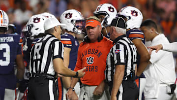 Oct 18, 2025; Auburn, Alabama, USA; Auburn Tigers head coach Hugh Freeze talks with game officials during the second quarter against the Missouri Tigers at Jordan-Hare Stadium. Mandatory Credit: John Reed-Imagn Images