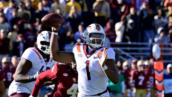 Nov 11, 2023; Chestnut Hill, Massachusetts, USA; Virginia Tech Hokies quarterback Kyron Drones (1) throws a pass during the first half against the Boston College Eagles at Alumni Stadium. Mandatory Credit: Eric Canha-USA TODAY Sports