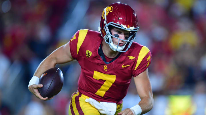 Aug 26, 2023; Los Angeles, California, USA; Southern California Trojans quarterback Miller Moss (7) runs the ball for a touchdown against the San Jose State Spartansduring the second half at Los Angeles Memorial Coliseum. Mandatory Credit: Gary A. Vasquez-USA TODAY Sports