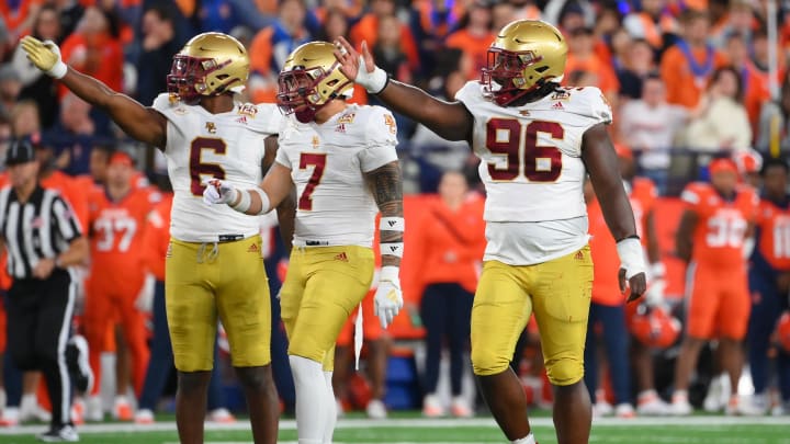 Nov 3, 2023; Syracuse, New York, USA; Boston College Eagles defensive end Donovan Ezeiruaku (6), defensive back Sione Hala (7), and defensive tackle Cam Horsley (96) react to a defensive play against the Syracuse Orange during the first half at the JMA Wireless Dome. Mandatory Credit: Rich Barnes-USA TODAY Sports