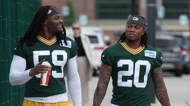 Green Bay Packers rookies Ty’Ron Hopper (59) and Javon Bullard arrive for OTAs on Ma 21.