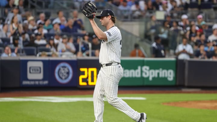 Jun 19, 2024; Bronx, New York, USA;  New York Yankees starting pitcher Gerrit Cole (45) waves to the crowd after he is taken out of the game in the fifth inning against the Baltimore Orioles at Yankee Stadium.
