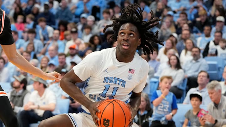 Dec 29, 2024; Chapel Hill, North Carolina, USA; North Carolina Tar Heels guard Ian Jackson (11) with the ball in the second half at Dean E. Smith Center. Mandatory Credit: Bob Donnan-Imagn Images