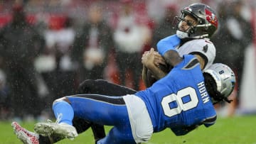 Dec 3, 2023; Tampa, Florida, USA; Tampa Bay Buccaneers wide receiver Mike Evans (13) is tackled by Carolina Panthers cornerback Jaycee Horn (8) in the second quarter at Raymond James Stadium. Mandatory Credit: Nathan Ray Seebeck-USA TODAY Sports