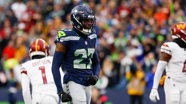 Nov 12, 2023; Seattle, Washington, USA; Seattle Seahawks cornerback Riq Woolen (27) reacts after a pass defense against the Washington Commanders during the second quarter at Lumen Field. Mandatory Credit: Joe Nicholson-USA TODAY Sports