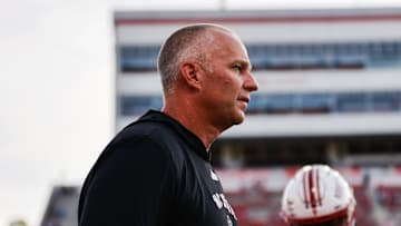 Aug 28, 2025; Raleigh, North Carolina, USA; North Carolina State Wolfpack head coach Dave Doeren looks on during the warmups prior to the game against East Carolina Pirates at Carter-Finley Stadium. Mandatory Credit: Jaylynn Nash-Imagn Images