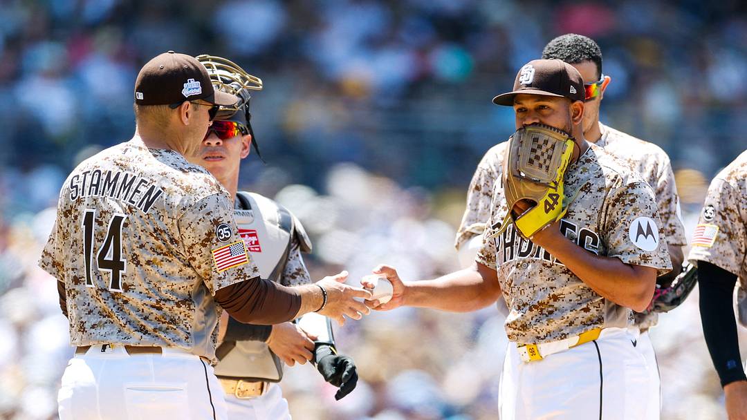 San Diego Padres manager Craig Stammen (14) takes the ball from starting pitcher Randy Vasquez (98) during a fifth inning pitching change against the New York Mets at Petco Park on June 7. San Diego Padres manager Craig Stammen (14) takes the ball from starting pitcher Randy Vasquez (98) during a fifth inning pitching change against the New York Mets at Petco Park on June 7.
