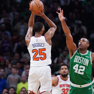 May 7, 2025; Boston, Massachusetts, USA; New York Knicks forward Mikal Bridges (25) shoots the ball against Boston Celtics center Al Horford (42) in the second half during game two of the second round for the 2025 NBA Playoffs at TD Garden. Mandatory Credit: David Butler II-Imagn Images