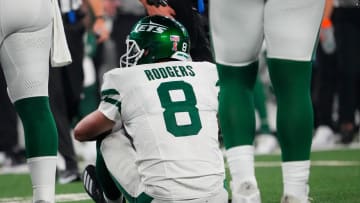 Sep 11, 2023; East Rutherford, New Jersey, USA; New York Jets quarterback Aaron Rodgers (8) sits on the field after a sack by Buffalo Bills defensive end Leonard Floyd (not pictured) at MetLife Stadium. Rodgers left the game with an injury after the play. 