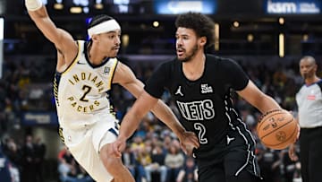 Mar 22, 2025; Indianapolis, Indiana, USA; Brooklyn Nets forward Cameron Johnson (2) goes to the basket against Indiana Pacers guard Andrew Nembhard (2) during the second half at Gainbridge Fieldhouse. Mandatory Credit: Robert Goddin-Imagn Images