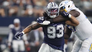 Aug 24, 2024; Arlington, Texas, USA; Dallas Cowboys defensive lineman Viliami Fehoko (93) is blocked by Los Angeles Chargers offensive tackle Alex Leatherwood (67) in the second quarter at AT&T Stadium. Mandatory Credit: Tim Heitman-Imagn Images