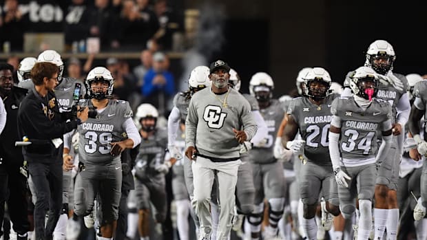 Oct 26, 2024; Boulder, Colorado, USA; Colorado Buffaloes head coach Deion Sanders leads out the team before the game against 